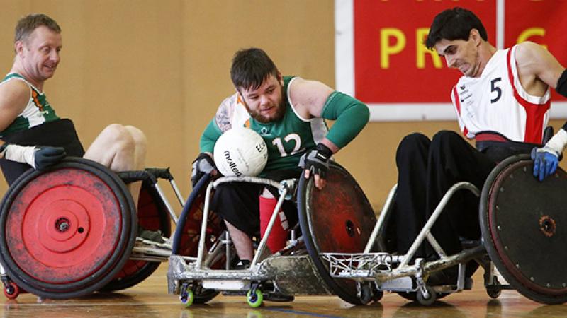 2015 IWRF Wheelchair Rugby European Championship A group of male wheelchair rugby players battling for the ball