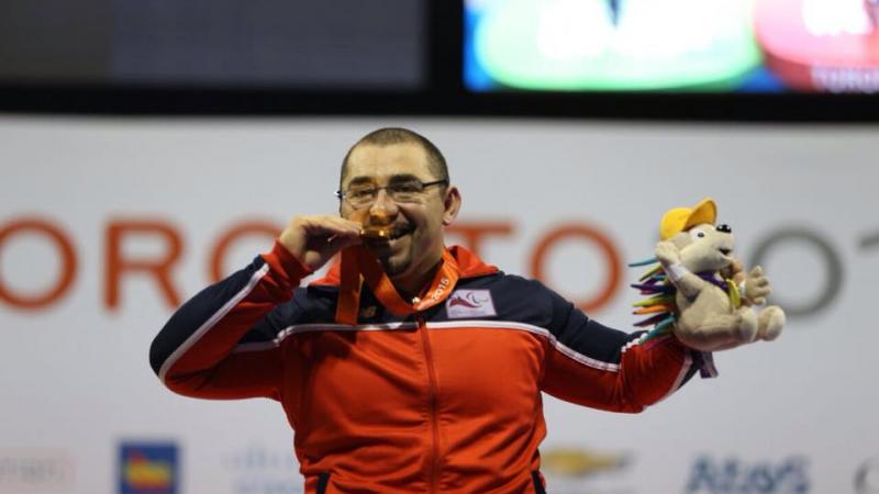 Juan Garrido Acevedo Chile's Juan Garrido Acevedo celebrates winning Toronto 2015 powerlifting gold.