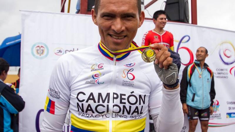 Alvaro Galvis - Colombia - cycling Man with cycling jersey showing his medal, smiling
