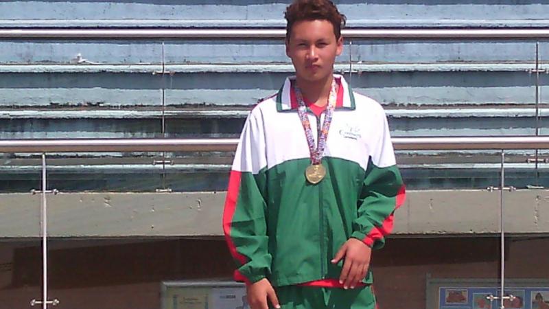 Diego Maldonado A swimmer poses with a medal