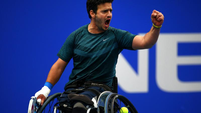Itay Erenlib - wheelchair tennis Wheelchair tennis player pumping his fist.