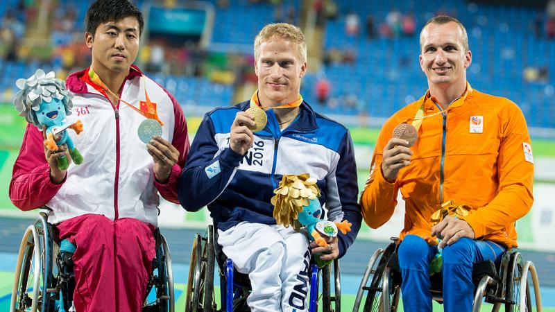 Leo Pekka Tahti - FInland - Rio 2016 Three men in wheelchairs on a podium showing their medals