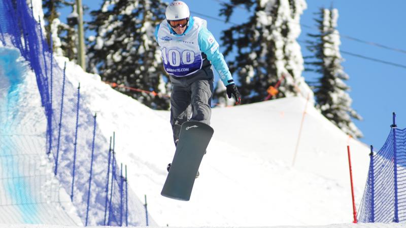 Argentina's Carlos Codina - snowboard Man on snowboard flies over a jump