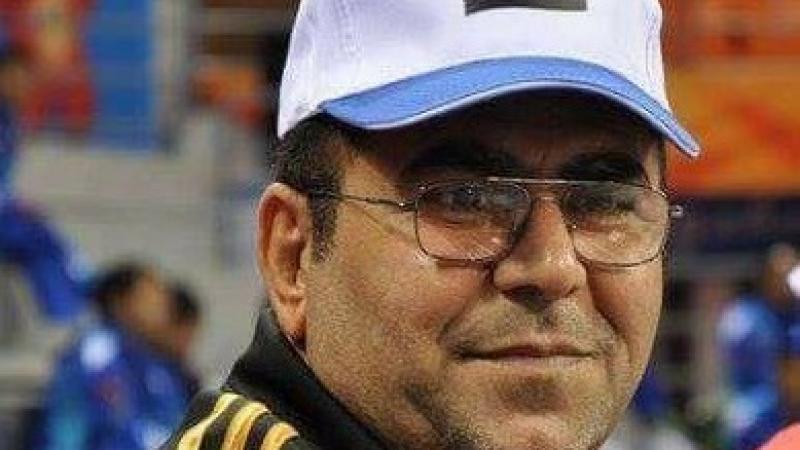 Fakhir Ali Al-Jamaly a man in a baseball cap smiles at the camera