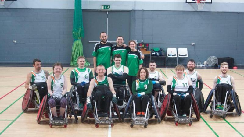 Ireland wheelchair rugby team the Ireland male and female wheelchair rugby team smiling on a court