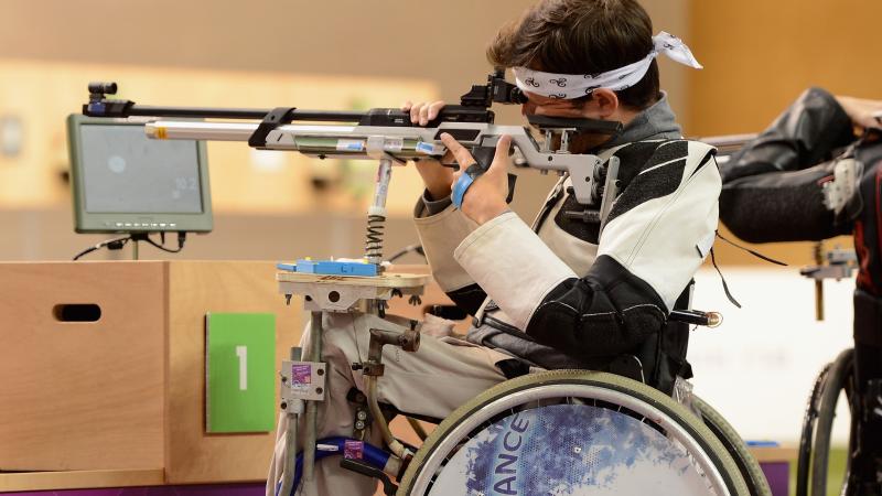 Shooting Para sport - Tanguy De La Forest - France - London 2012 Man in a wheelchair shooting a rifle