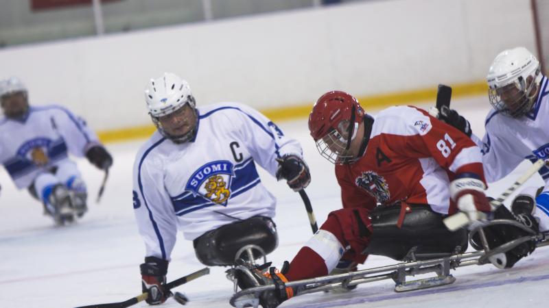 Markku Hirvela - Finland - Para ice hockey male Para ice hockey player Markku Hirvela defends the puck from a Polish player