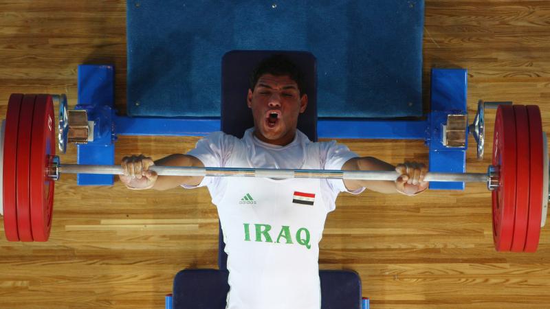 Rasool Mohsin - Iraq male powerlifter Rasool Mohsin yells as he lifts the bar