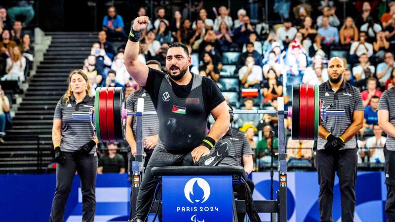 An athlete reacts after his lift