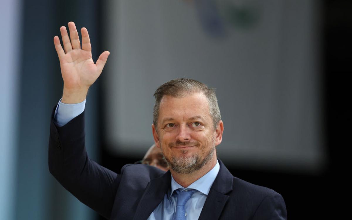 Andrew Parsons waves to the crowds at the Games