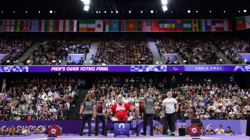 A packed arena watching a Para powerlifting competition